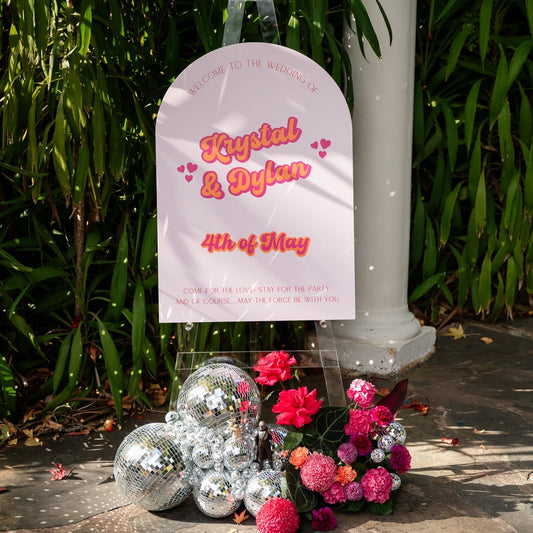 Arch Wedding welcome sign with flowers and disco balls